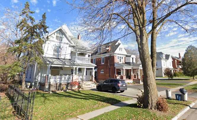 Large white brick house.