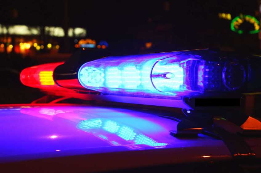 Red and blue lights on top of a police car.