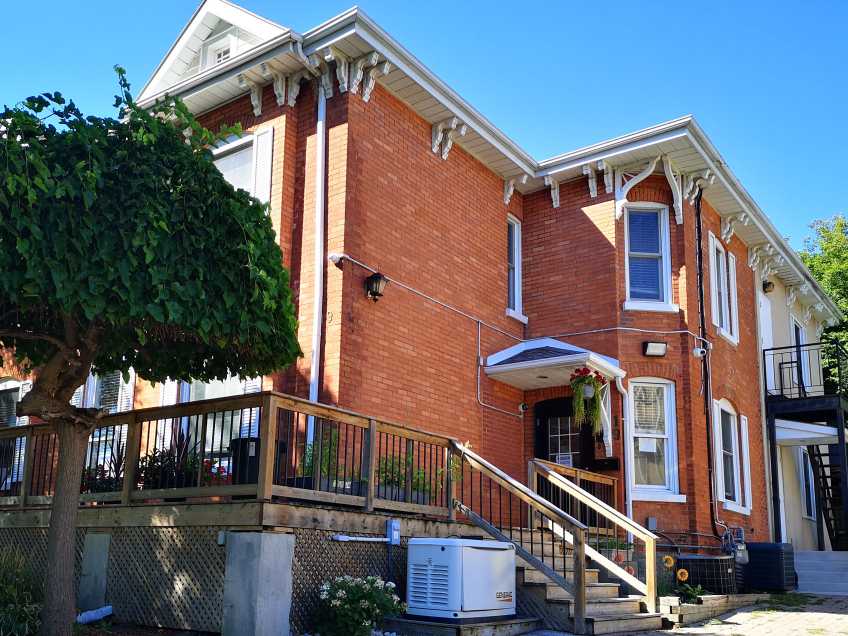 two storey brick house with porch