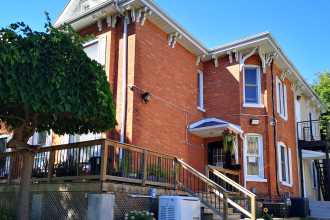 two storey brick house with porch